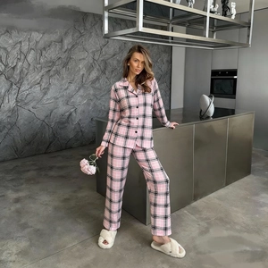 Cozy pink and black plaid pajama set with button-up long sleeves and matching trousers