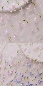 Macro detail of 3D embossed butterfly and flower nail stickers with iridescent laser finish