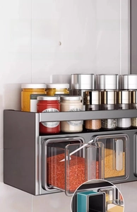 Wall-mounted seasoning box with drawer-style compartments and individual spoons