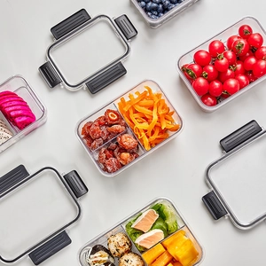 Divided food storage containers with black locking lids for meal prep and kitchen storage