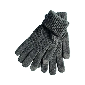 Detailed view of dark grey knitted gloves with folded cuffs and jacquard diamond pattern