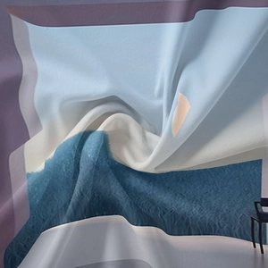 Artistic detail of bohemian tapestry featuring abstract geometric prints in blue and lilac tones