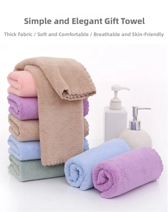 Stack of thick absorbent cotton towels in diverse colors with soft textures for bathroom use