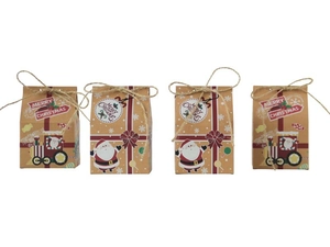 Detail of kraft paper Christmas gift boxes featuring Santa prints and twine bow closures
