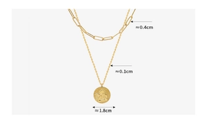 Detailed view of gold layered necklace featuring paperclip chain and angel pendant measurements