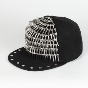 Close-up of black canvas hip hop hat with silver metal spikes and rivet details