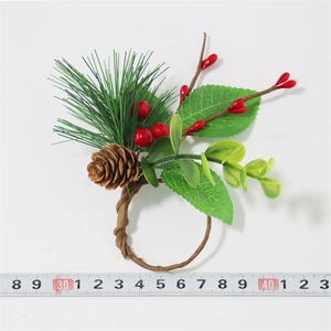 Detail showing Christmas napkin ring size with pine needles, red berries and pinecone
