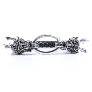 Retro dragon head leather bracelet with metallic ring and detailed carvings in vintage style
