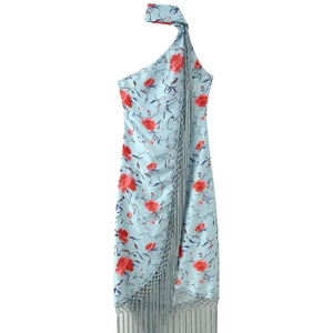 Abito lungo monospalla azzurro a fiori con stampe rosse e dettagli con frange