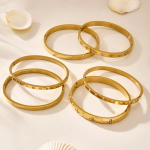 Elegant gold-plated geometric bangle set with zircon inlays and polished finish