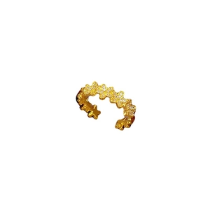 Adjustable gold flower row open ring with small zircon stones on white background