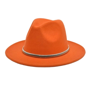 Detailed view of an orange wool fedora with flat wide brim and silver metal band
