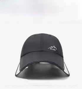 Detailed embroidery of white mountains and sport logo on black quick-dry outdoor cap