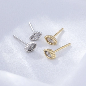 Macro shot of S925 sterling silver marquise studs with zircon in gold and silver finish