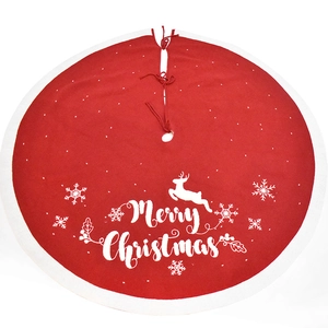 Red knitted Christmas tree skirt with embroidered reindeer, snowflakes and Merry Christmas