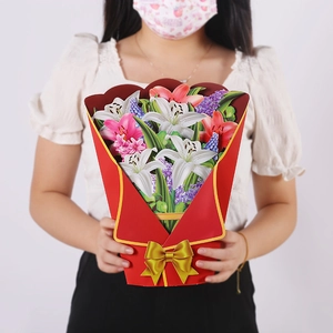 Detailed 3D pop-up bouquet card with white and pink lilies being held by hands