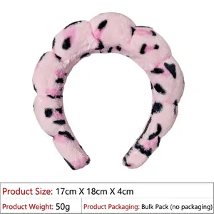 Pink plush headband with black spots showing dimensions 17cm x 18cm x 4cm and 50g weight