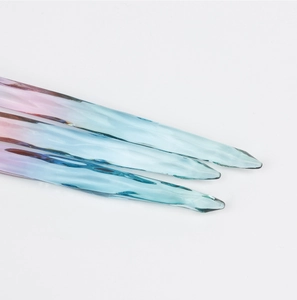 Detail of crystal clear gradient resin pendant with irregular water ripple texture