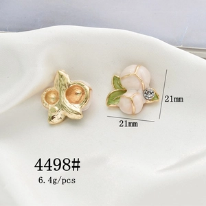 Detail of 21mm peach-shaped alloy charm with pink enamel, green leaf and rhinestone