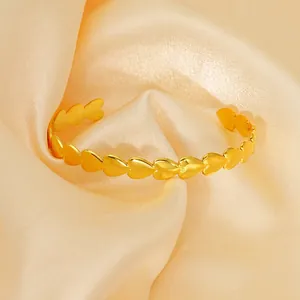 Adjustable golden heart open cuff bracelet with irregular polished heart shapes