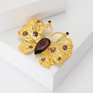 Exquisite golden butterfly brooch with brown teardrop gem and pink rhinestones
