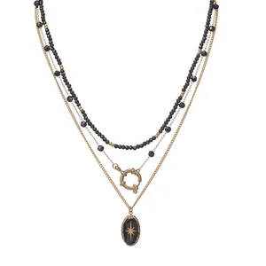 Three-layer bohemian necklace featuring black beads and an eight-pointed star pendant