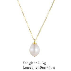 Detailed view of single baroque pearl pendant with golden adjustable chain necklace