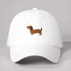 White cotton baseball cap with embroidered brown dachshund dog in a vintage style