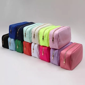 Waterproof nylon cosmetic bags in various vibrant colors with elegant gold zippers