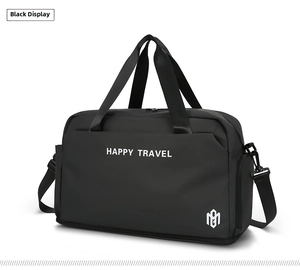 Macro detail of waterproof black travel bag with Happy Travel text and adjustable strap