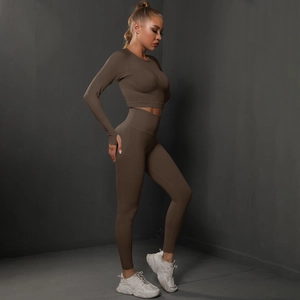 Detailed side view of dark coffee seamless yoga set with long sleeve crop top and high waist leggings