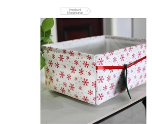 Close-up of foldable Oxford cloth storage basket with red festive snowflake patterns