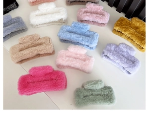 Detailed overhead view of assorted plush square hair claws in vibrant multiple colors