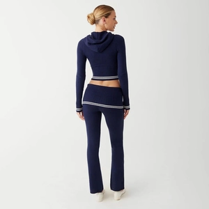 Women's dark blue knit two-piece set with cropped hoodie and flared trousers