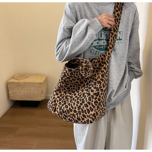 Trendy leopard print canvas crossbody tote bag with wide shoulder strap for casual wear