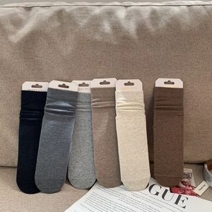 Assorted 6-pack of ribbed cotton slouch socks displayed on a cozy fabric sofa