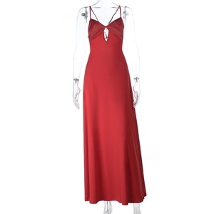 Detailed view of the red satin slip dress fabric texture and deep V-neckline finish