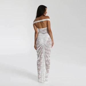 Detail of white lace backless dress showing shirred texture and slim fit silhouette