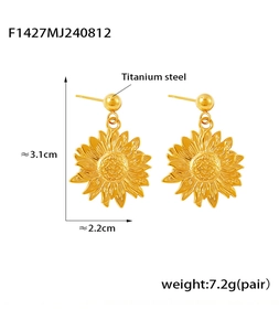 Detail view of gold sunflower titanium earrings showing size 3.1cm and 7.2g weight