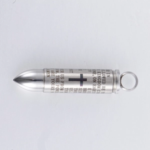 Detail of cross-engraved bullet pendant featuring Lord's Prayer on stainless steel