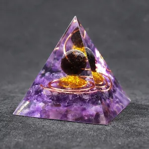 Orgonite energy pyramid with amethyst stones, copper coil and obsidian sphere for decor