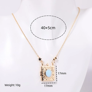 Vintage gold locket necklace with light blue gemstone in a square book-shaped pendant