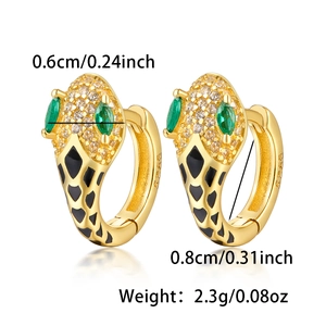 Detailed view of S925 snake earrings with green gems and size weight markings