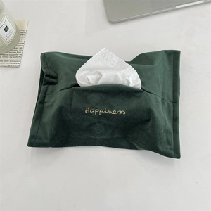 Detail of dark green velvet tissue holder with golden Happiness embroidery and matte finish