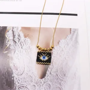 Bohemian evil eye pendant necklace with handmade beads and golden chain for women