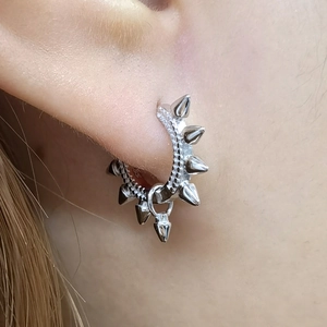 Macro view of sterling silver spiked ear cuff with micro-set white cubic zirconia stones
