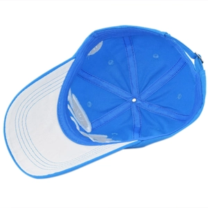 Detail view of the inner structure and contrast stitching of the blue baseball cap