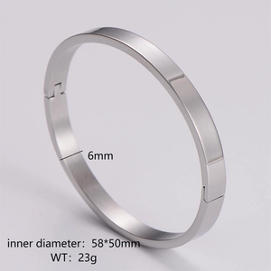Detailed specs showing 6mm width and 58x50mm inner diameter of a polished steel bangle