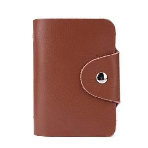 Brown genuine leather card holder wallet with a secure metal snap button closure