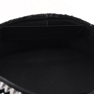 Macro detail of the breathable mesh lining and elastic adjustment band inside the black cap